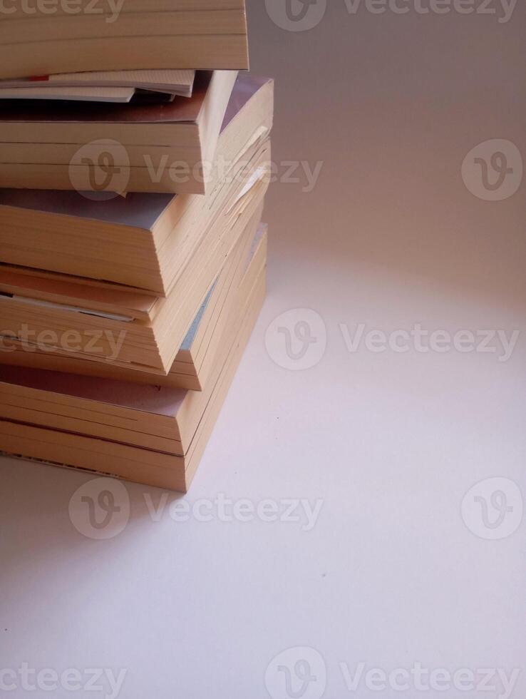 photo of a stack of books that have started to yellow