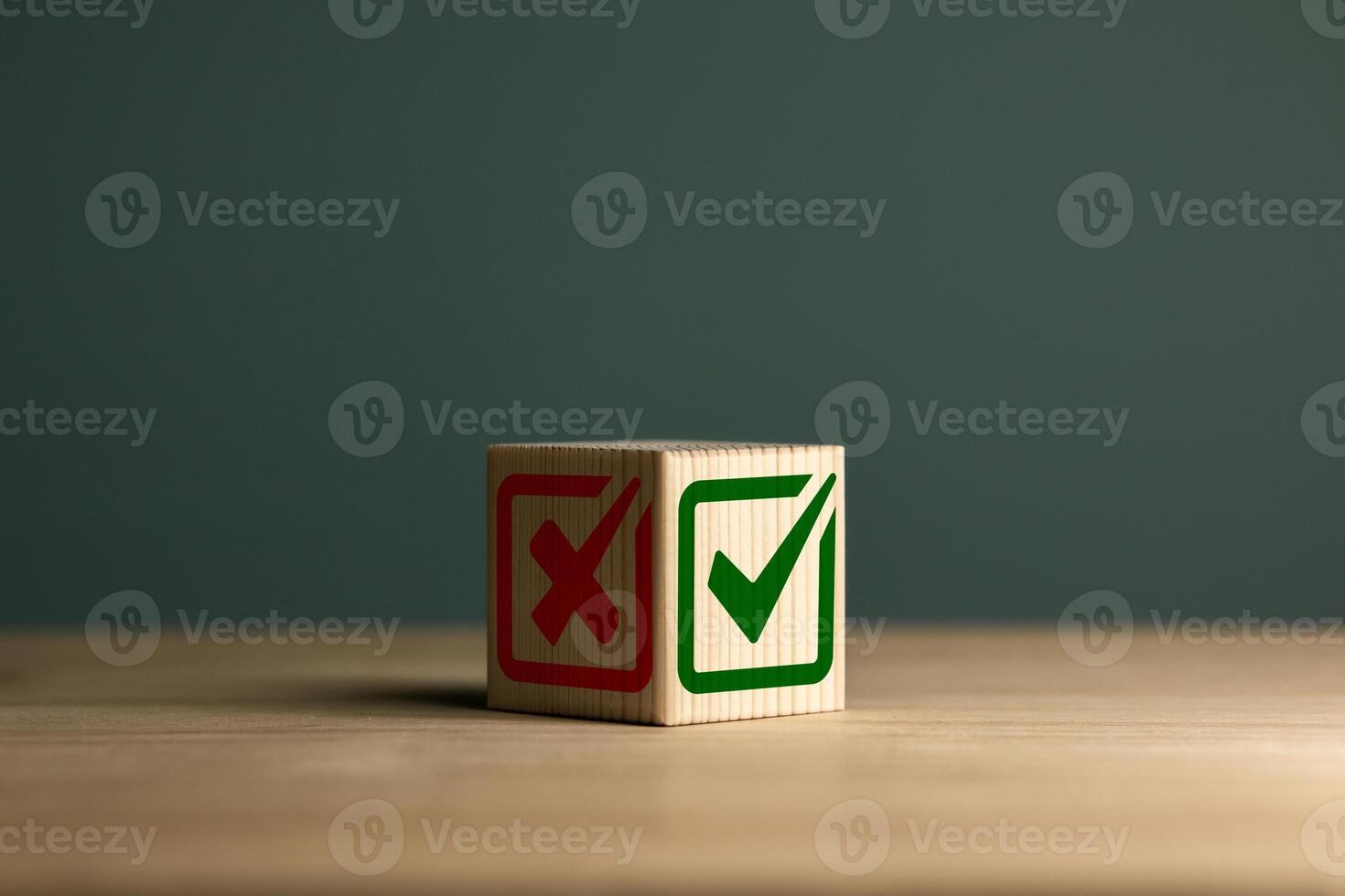 Green check mark and red cross icon on wooden cube. Right and wrong. Checklists, approval lists, and test concepts. photo