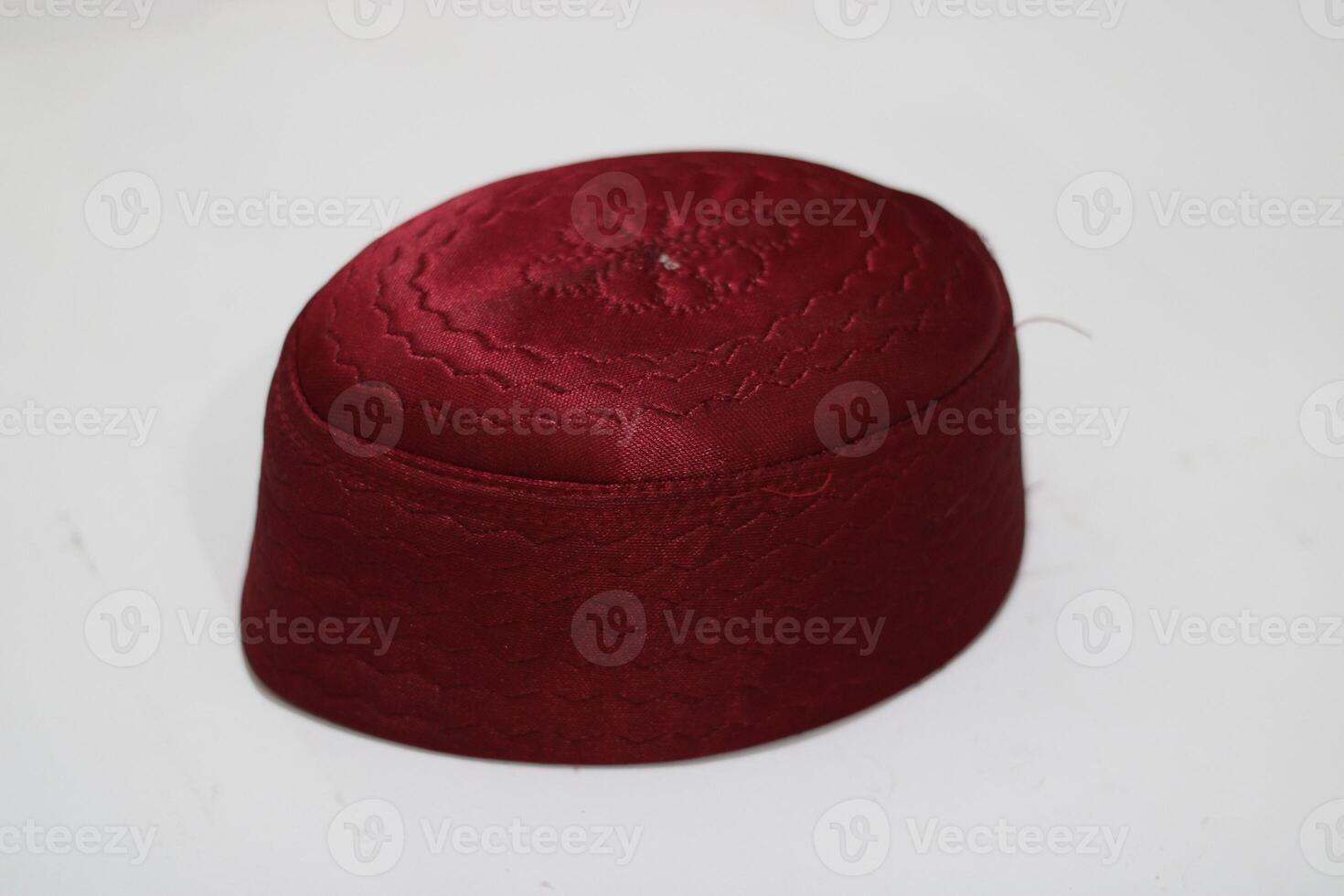 Red embroidered cap with a wave pattern isolated on white. photo