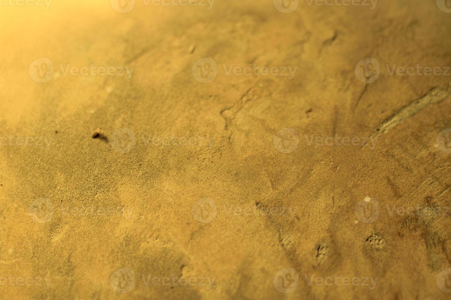 Close-up of rough, textured, yellow surface. photo