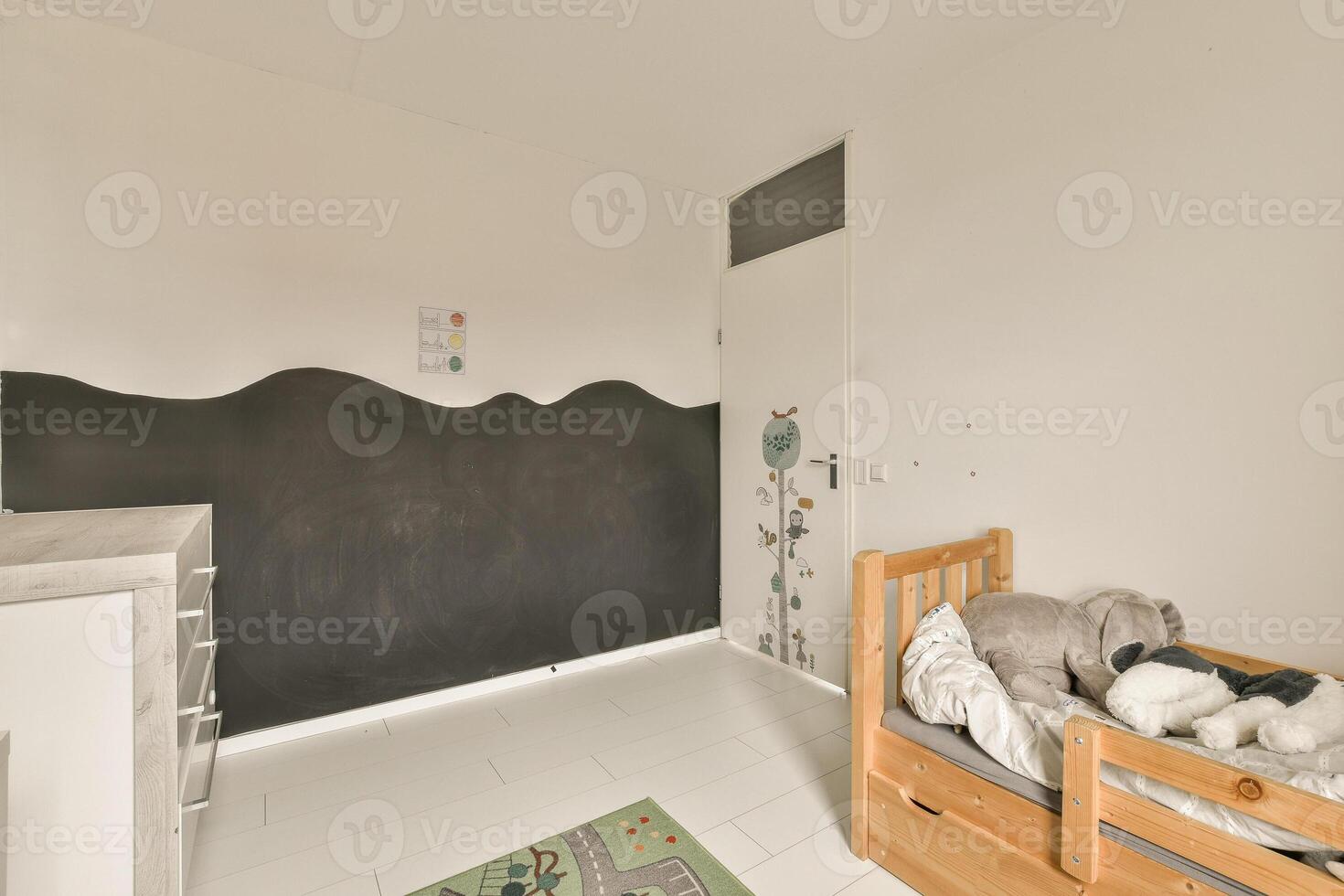 A small room with a blackboard on the wall photo