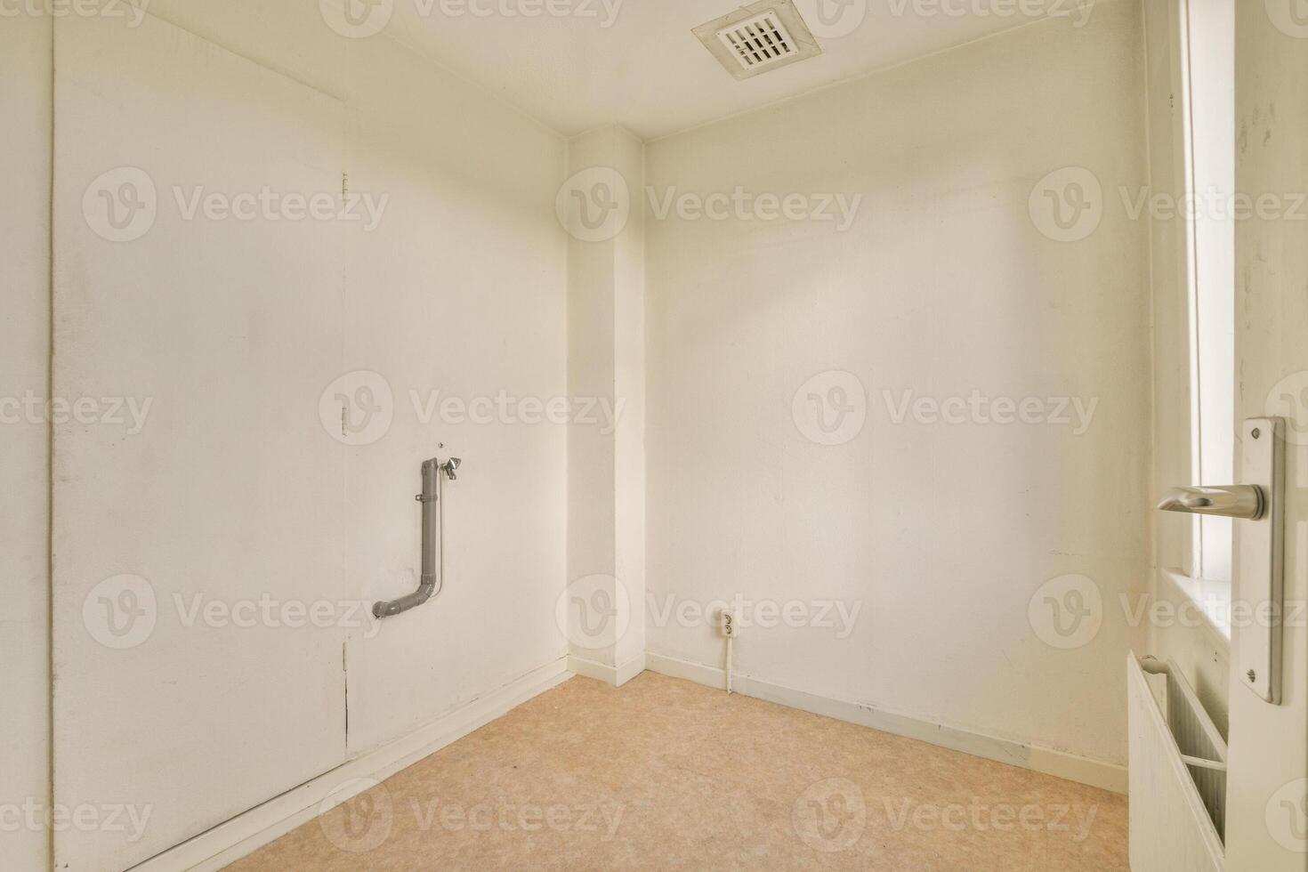 A white door with a window in the corner photo