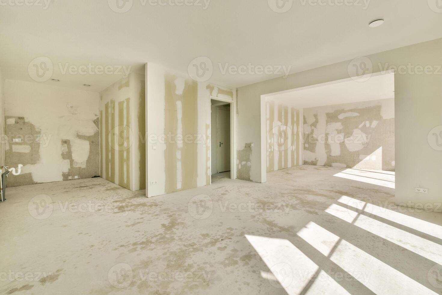An empty room with drywall and paint on the walls photo