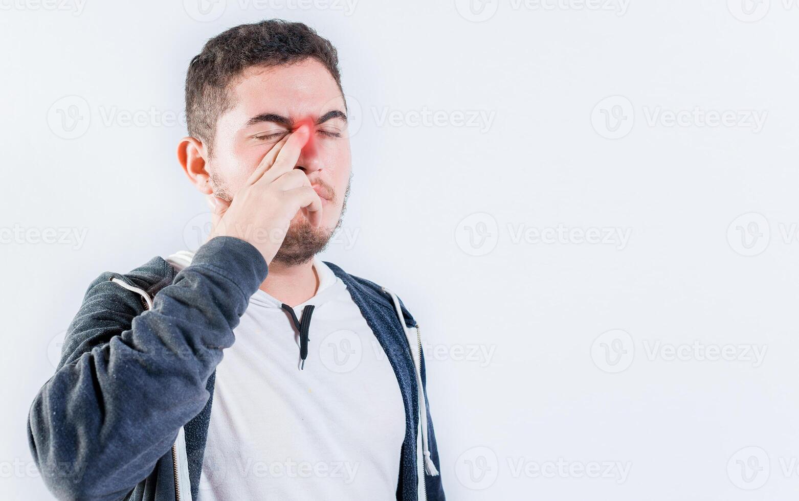 Person with sinusitis and nasal inflammation. Man with nasal congestion isolated photo