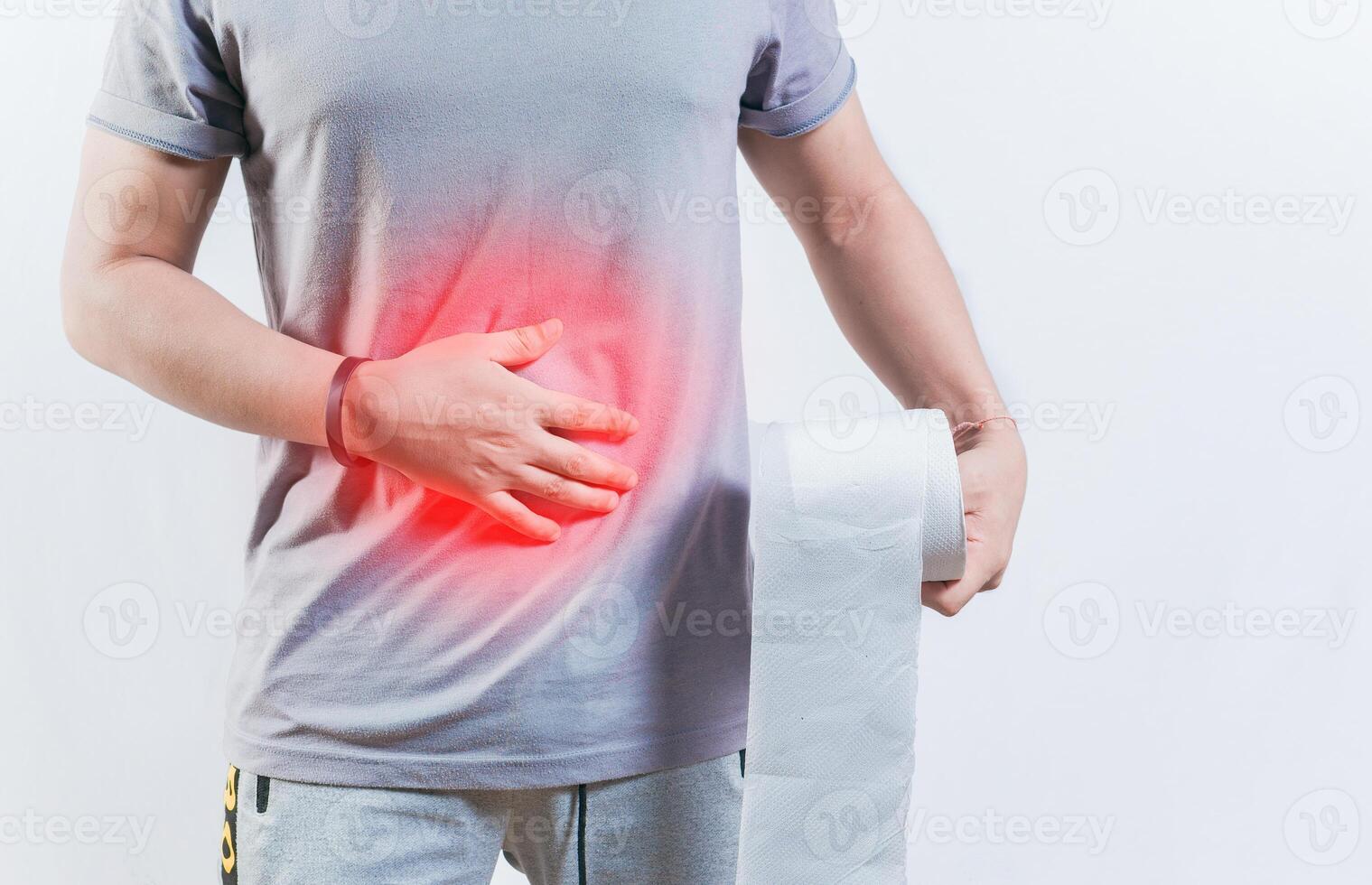 Person with diarhea holding toilet paper roll. Diarhea and stomach problems concept photo