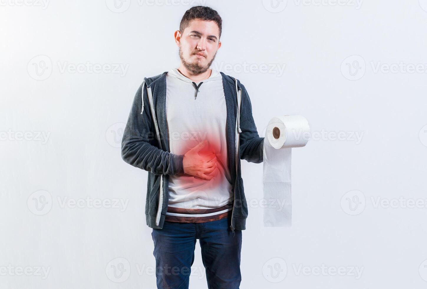 Person with diarrhea and stomach problems holding toilet paper. Man suffering with stomach pain holding roll of paper isolated photo