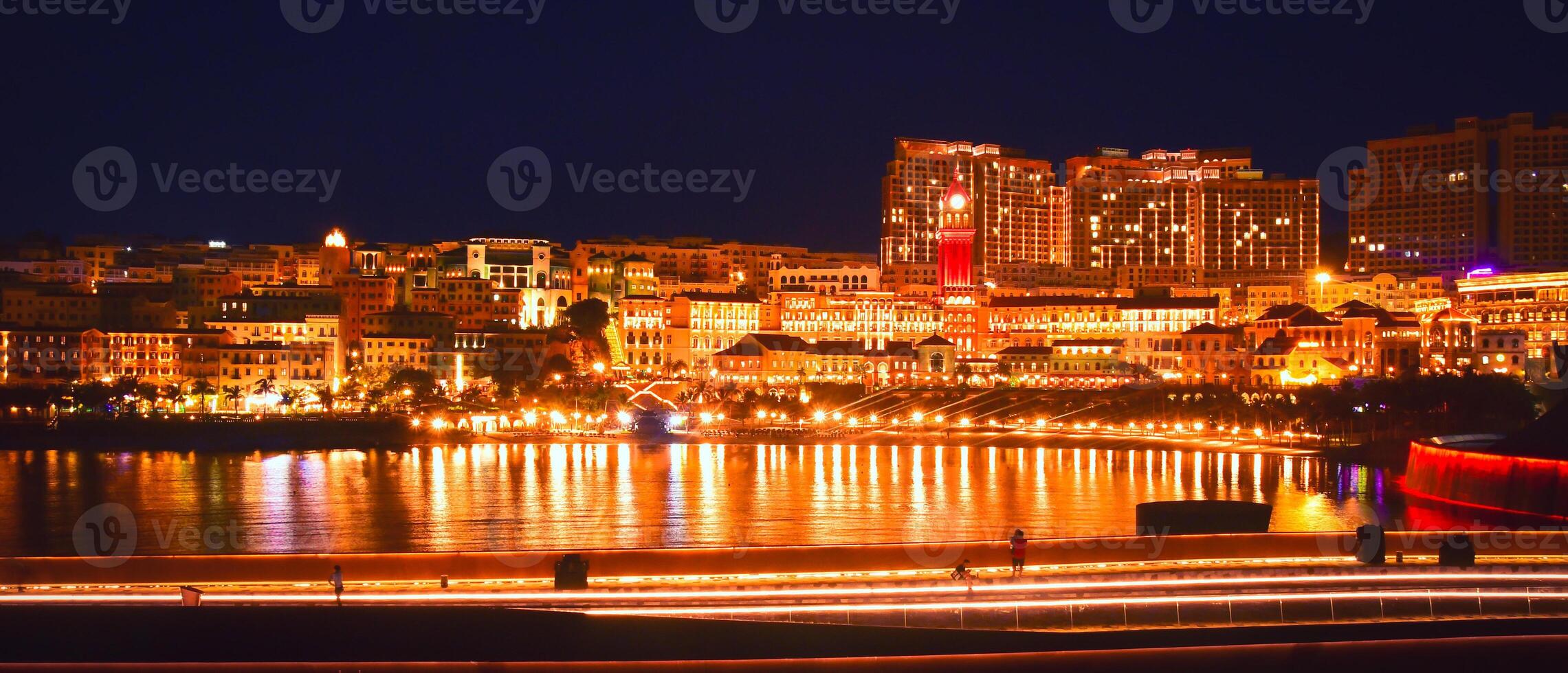 Phuy Quoc, Vietnam - february 15th, 2024- illuminated Sunset town beach, top destination on the pearl island of Phu Quoc. Kiss bridge.Famous european architecture at night photo