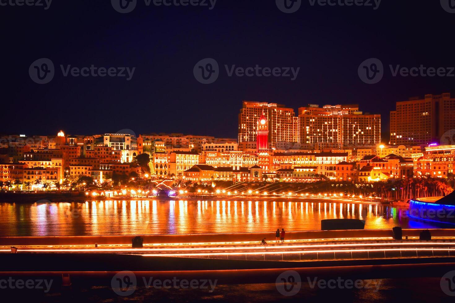Phuy Quoc, Vietnam - february 15th, 2024 - illuminated Sunset town beach, top destination on the pearl island of Phu Quoc. Kiss bridge.Famous european architecture at night photo