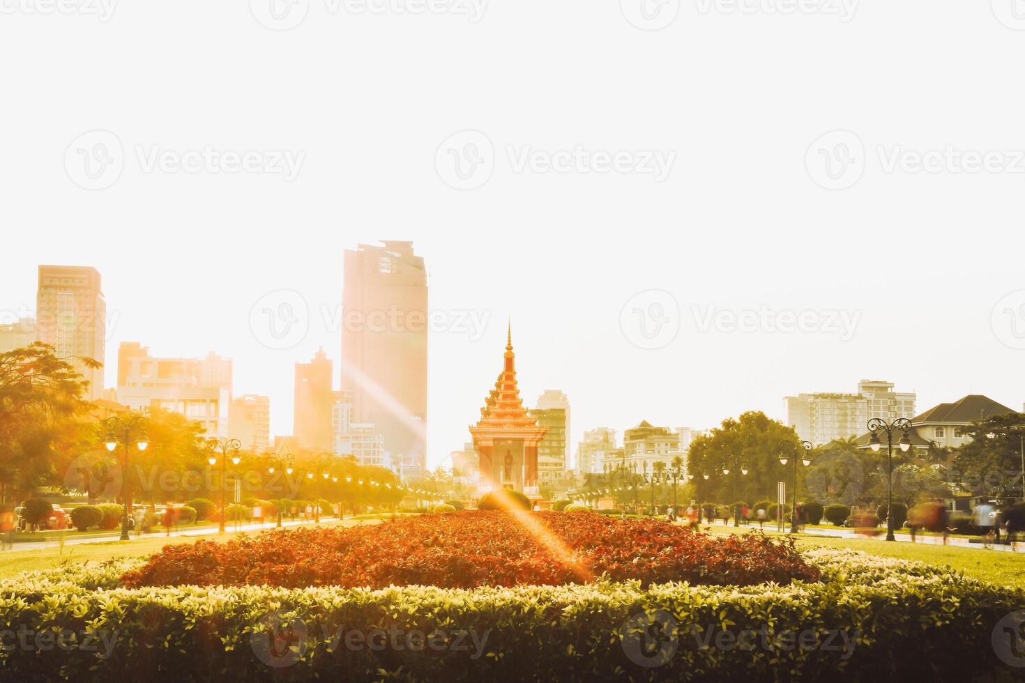 Phnom Penh ,Cambodia - 16th february, 2024- people tourist in motion walk in streets by The Independence Monument in Phnom Penh. Statue of King Father Norodom Sihanouk photo