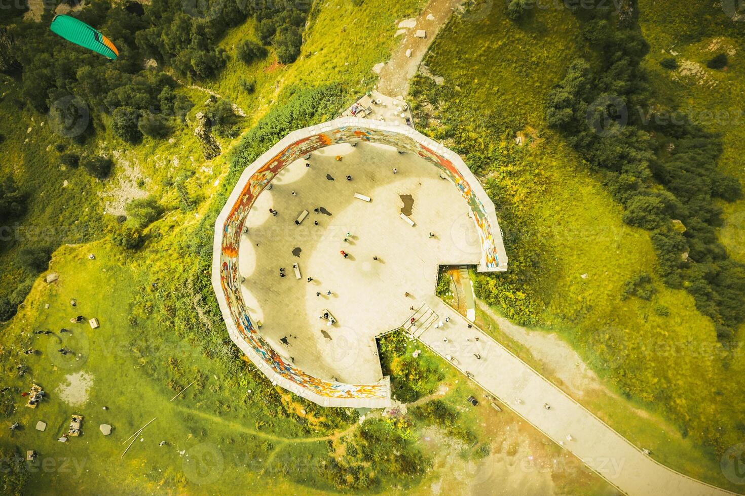 Kazbegi, Georgia - 8th september, 2024 aerial top down view tourist visit famous landmark, Russia Georgia Friendship Monument or Treaty of Georgievsk Monument photo