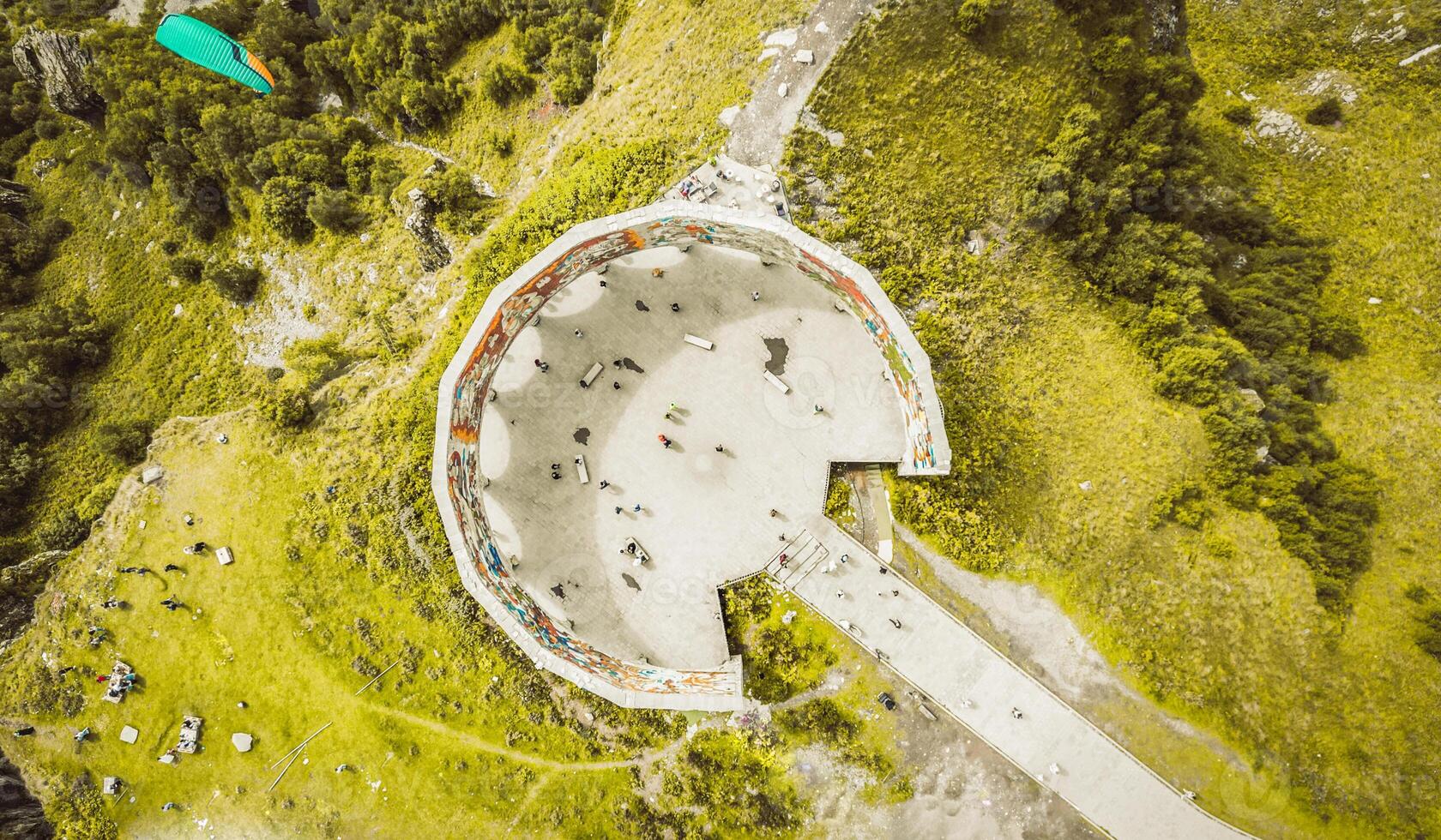 Kazbegi, Georgia - 8th september, 2024- aerial top down view tourist visit famous landmark, Russia Georgia Friendship Monument or Treaty of Georgievsk Monument photo