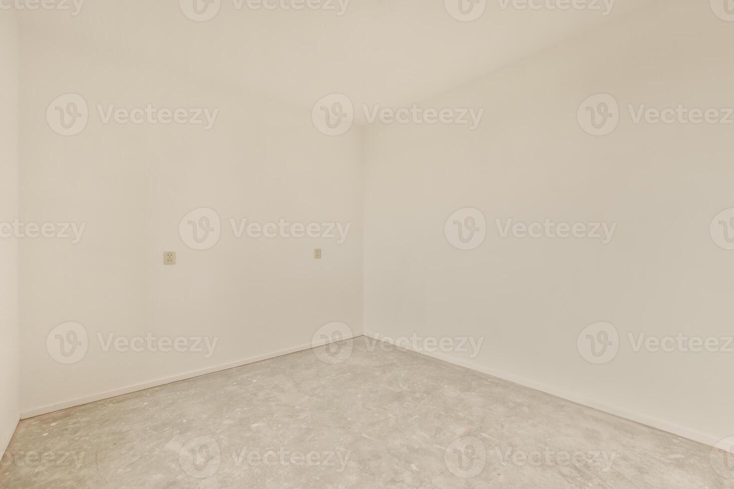 An empty room with white walls and a door photo