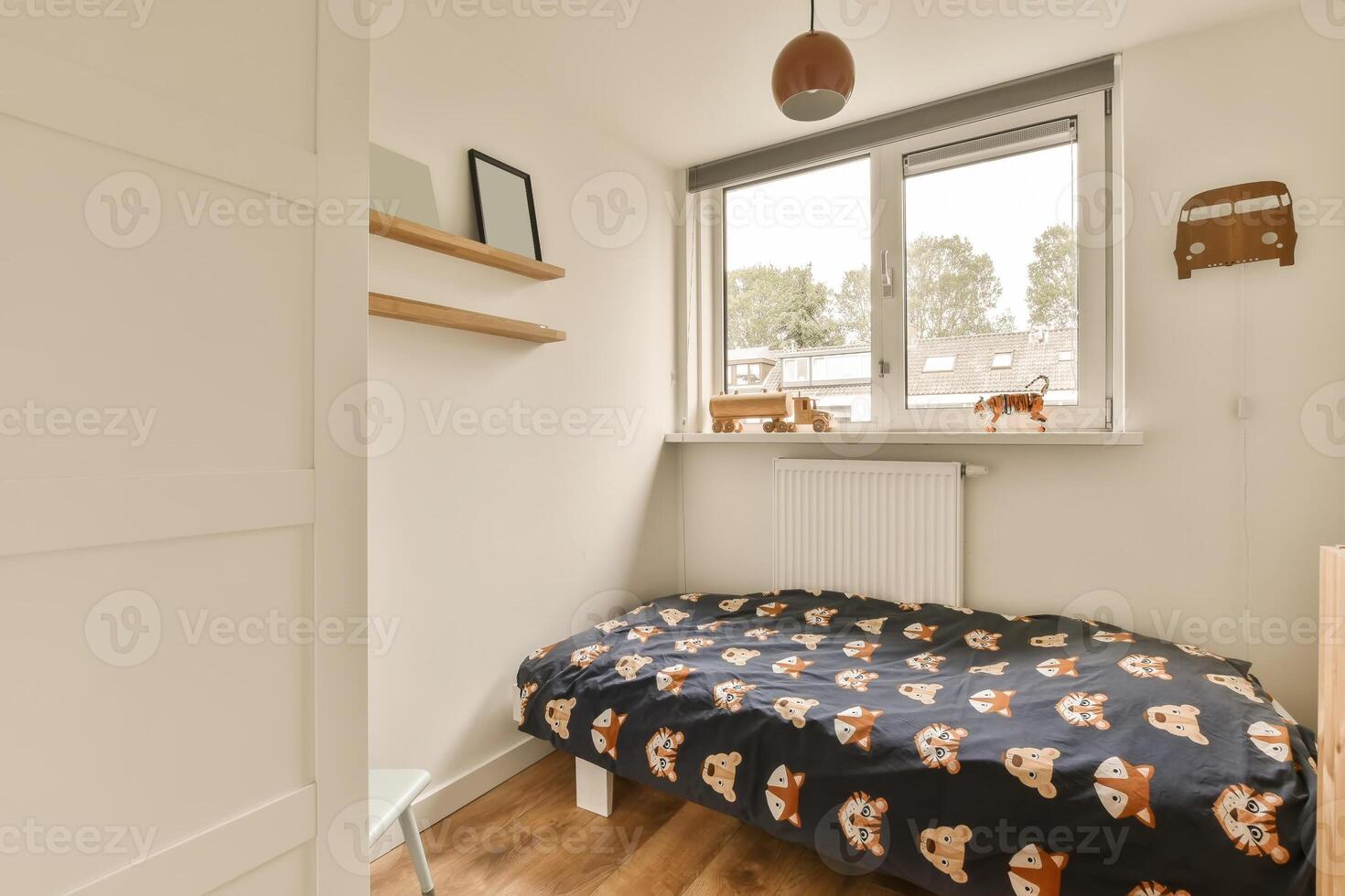 A small bedroom with a bed and a window photo