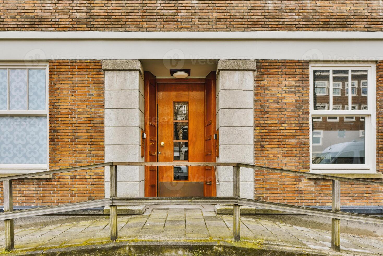 A building with a door and a railing photo