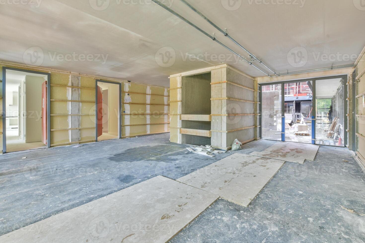 A room with a lot of construction materials and a door photo