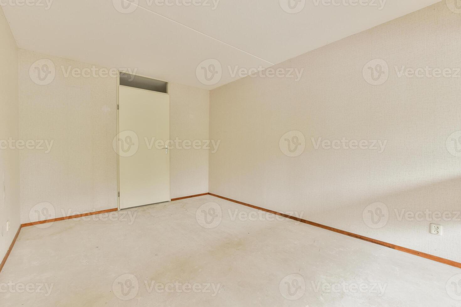 Empty room with white walls and carpet photo