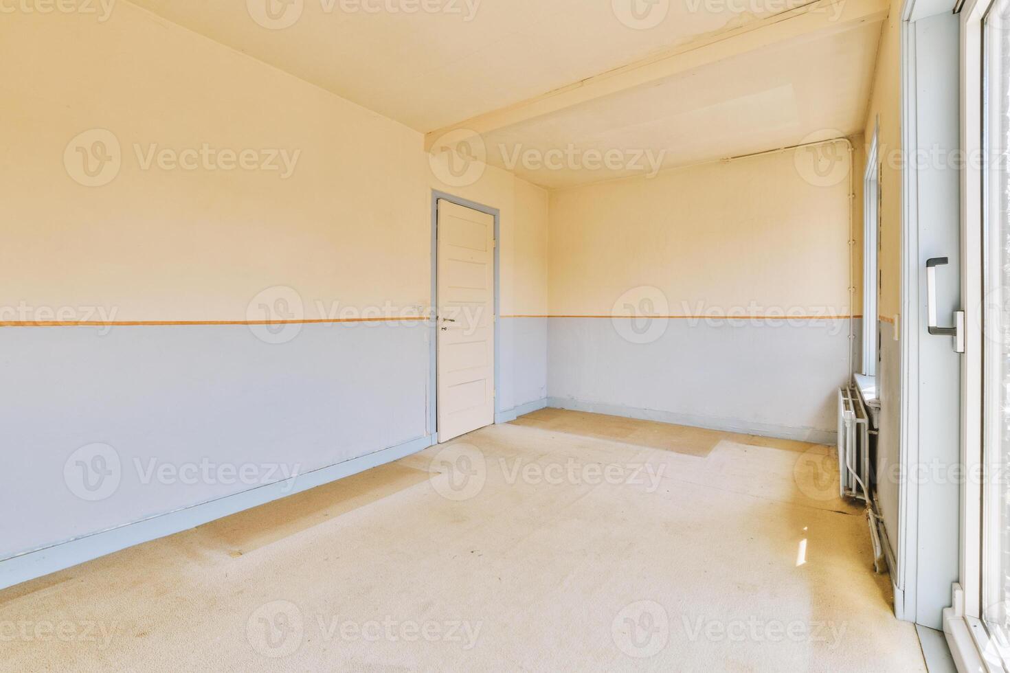 A room with a door and a window in it photo