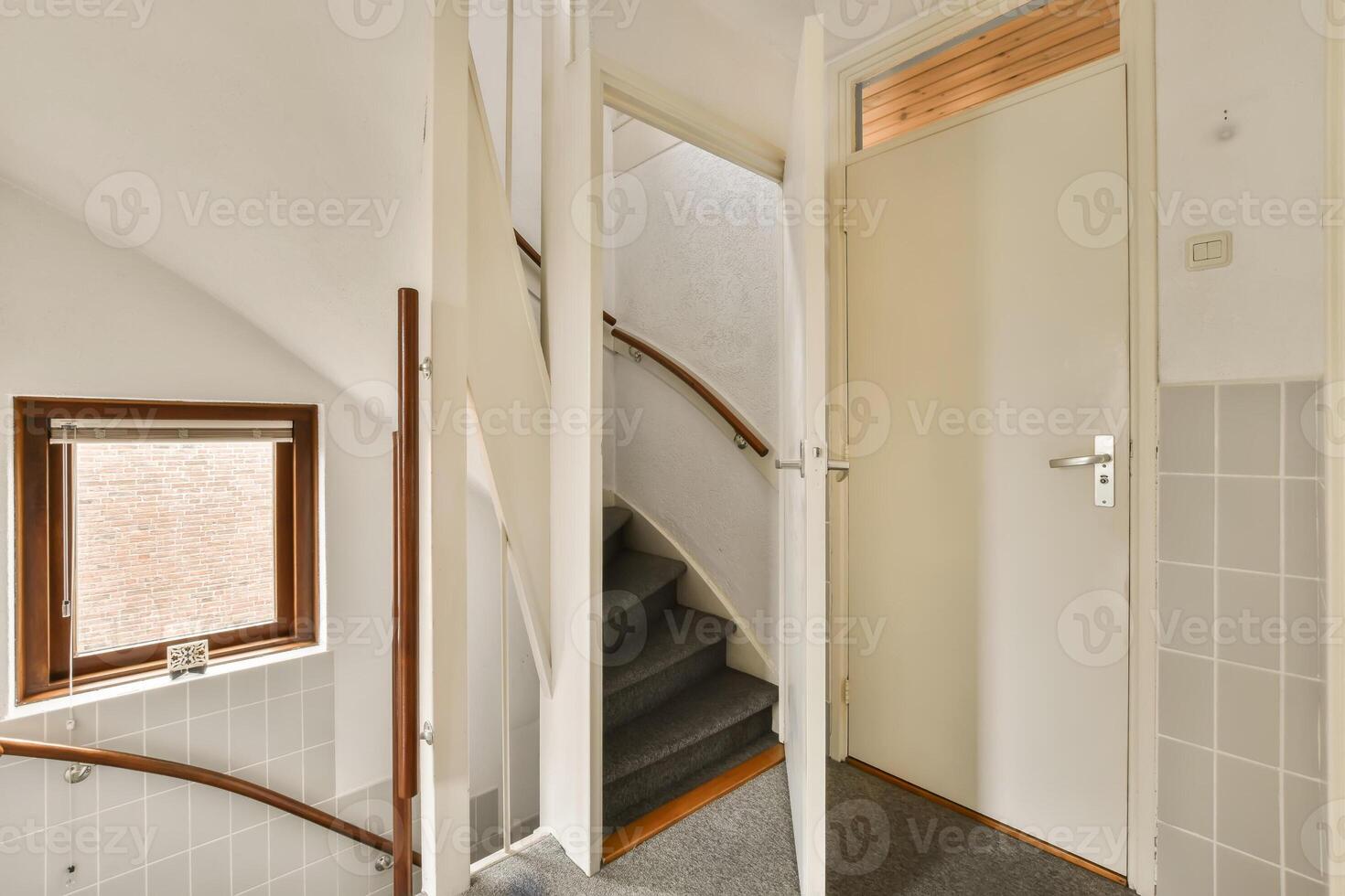 A stairway leading to a door and a window photo