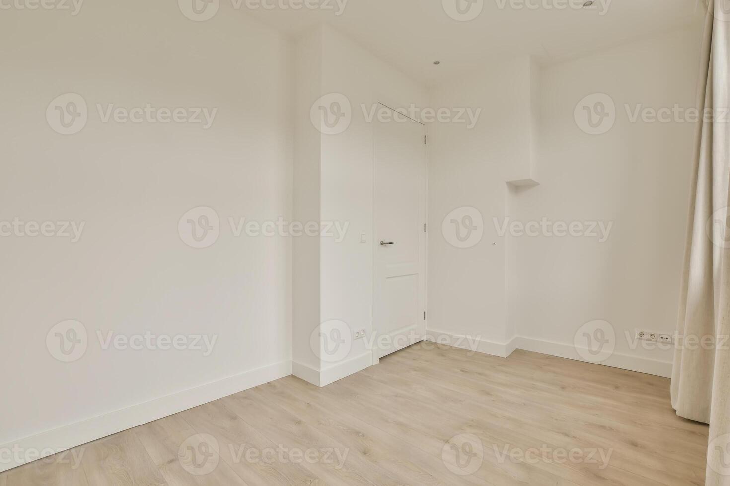 An empty room with a door and a window photo