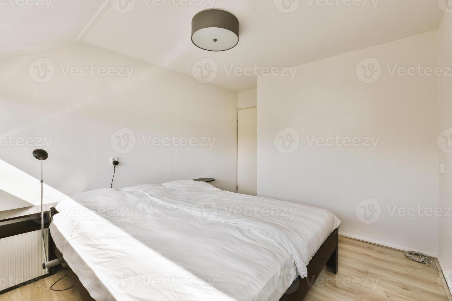 White bed in a bedroom photo