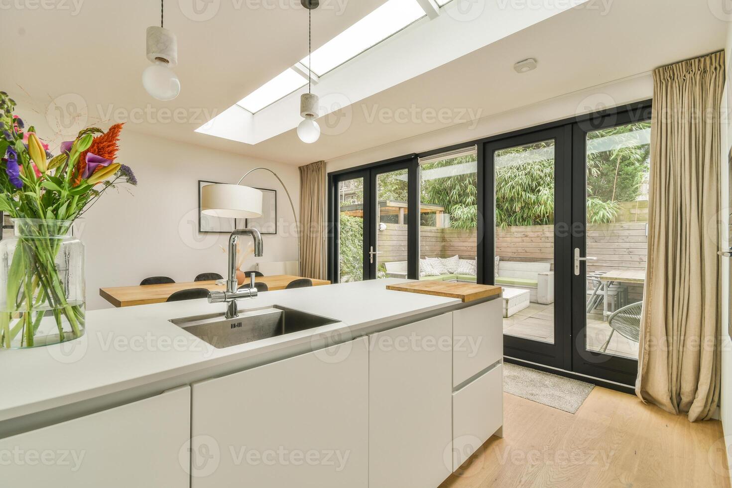 A kitchen with a sink and a window photo