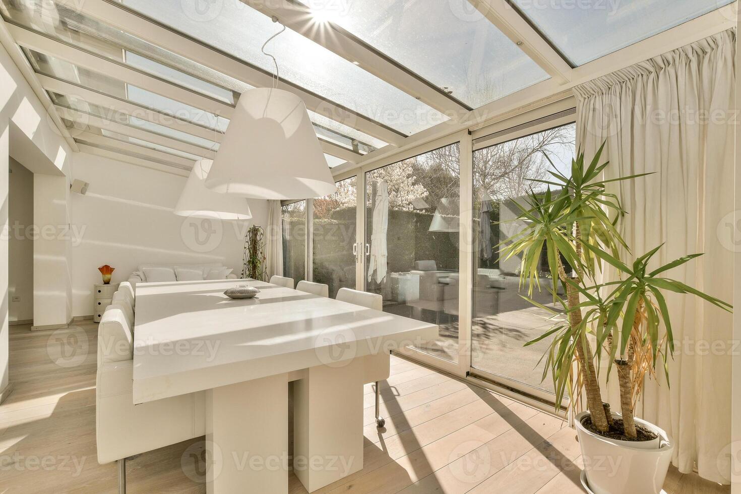 A dining room with a large glass roof photo