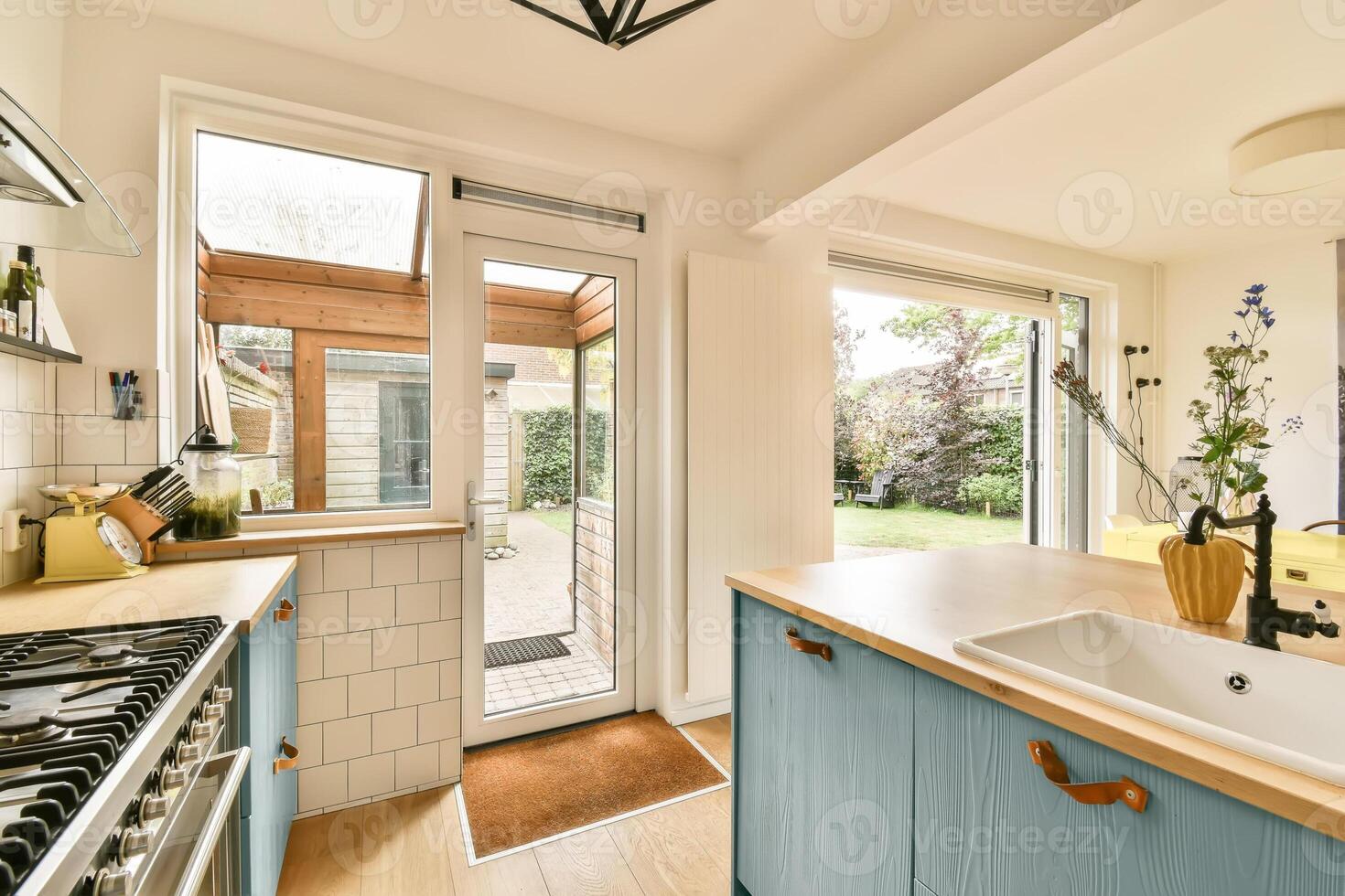 A kitchen with a sink and a window photo