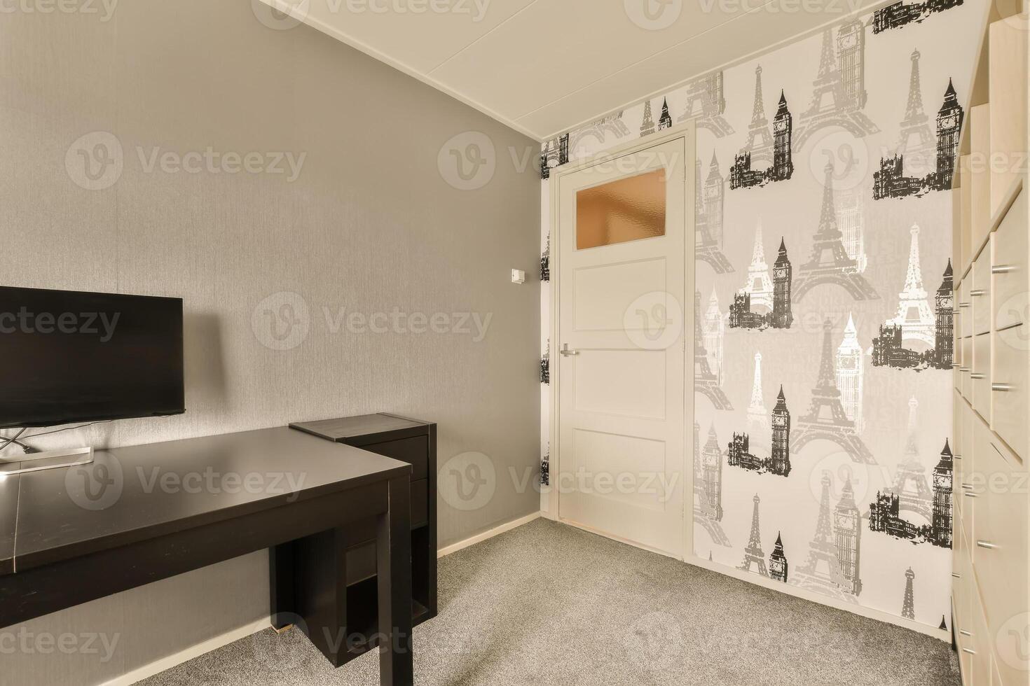 A desk with a computer photo