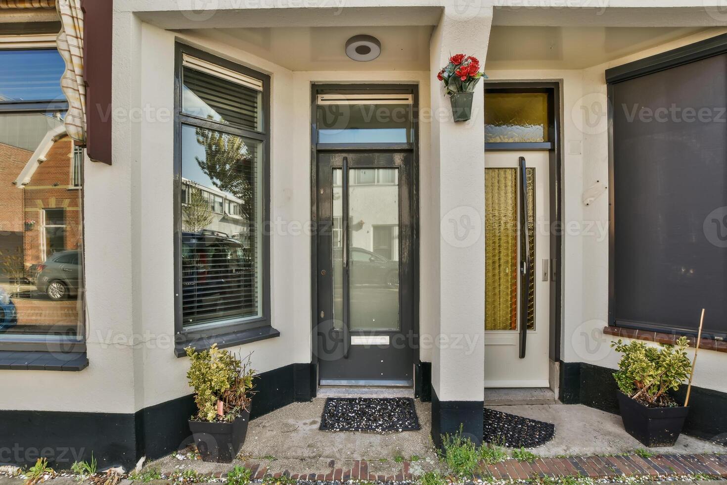A house with a door and windows on the side of the street photo
