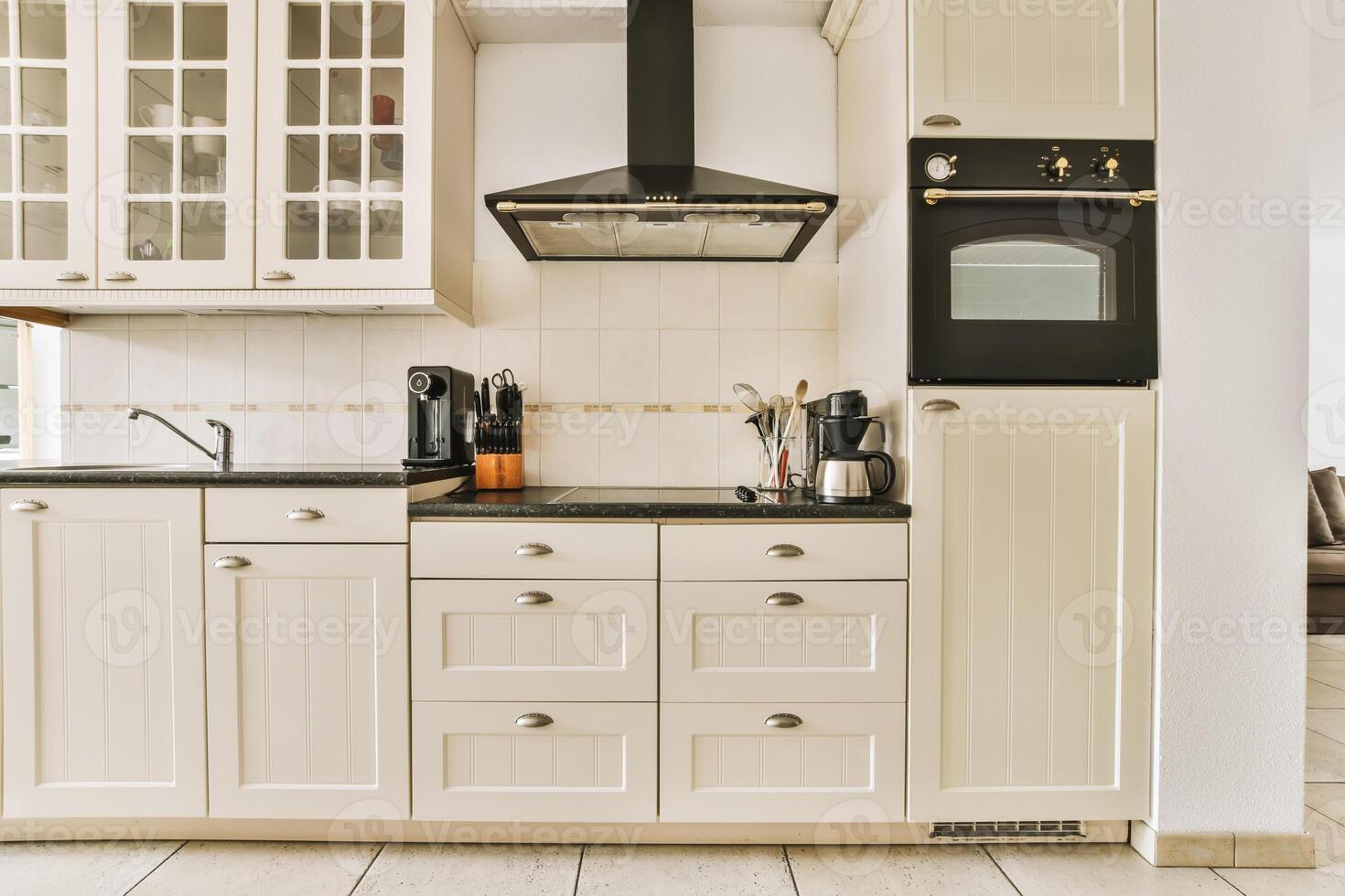 A kitchen with a stove and oven photo