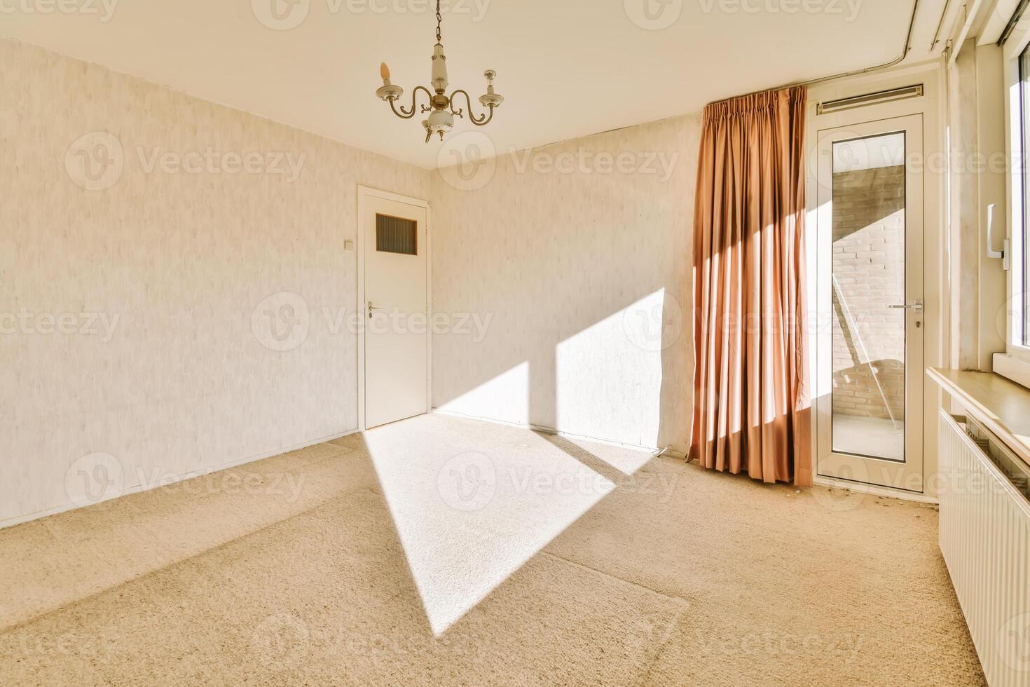 A room with a chandelier and a window photo