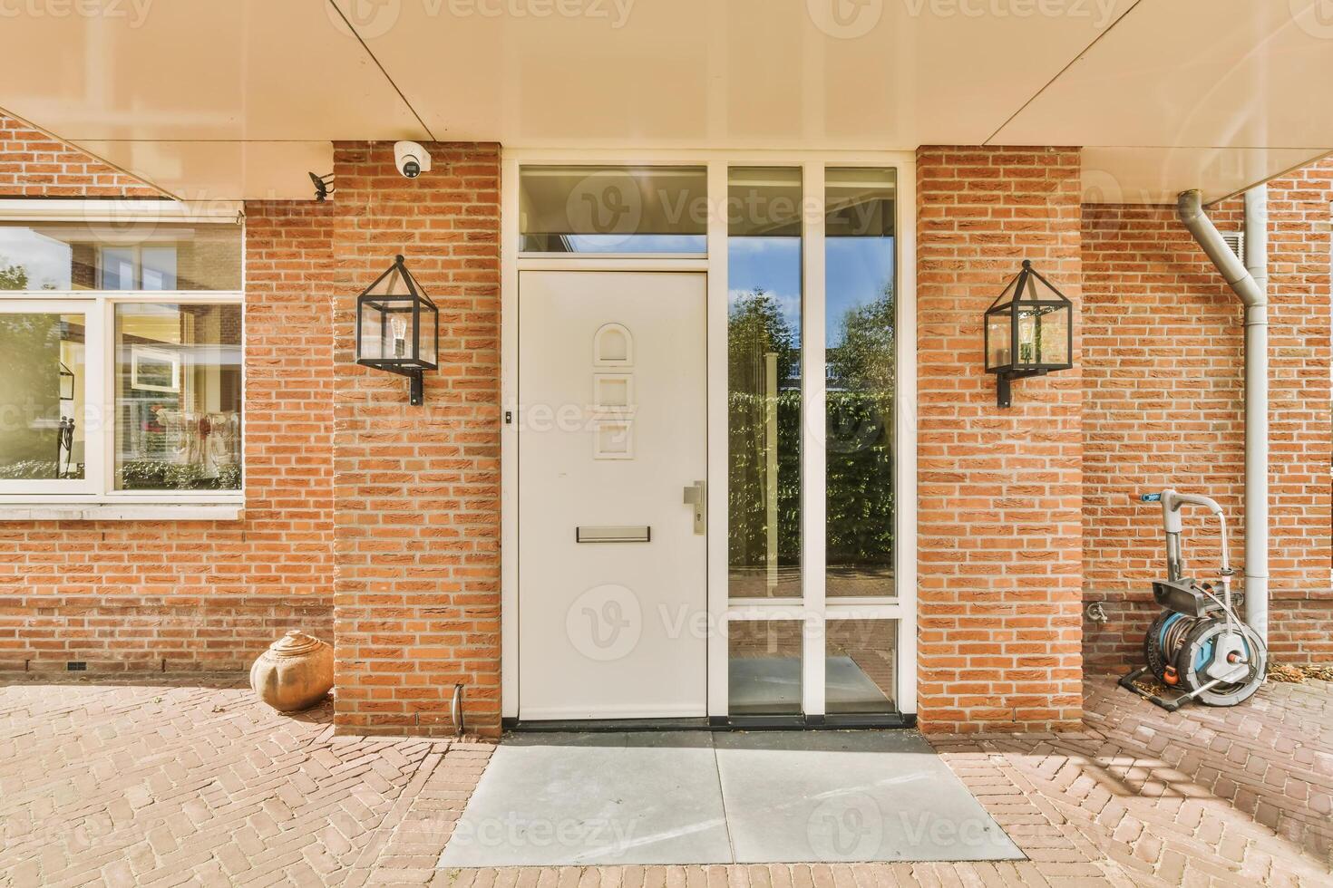A brick house with a door and a bike photo