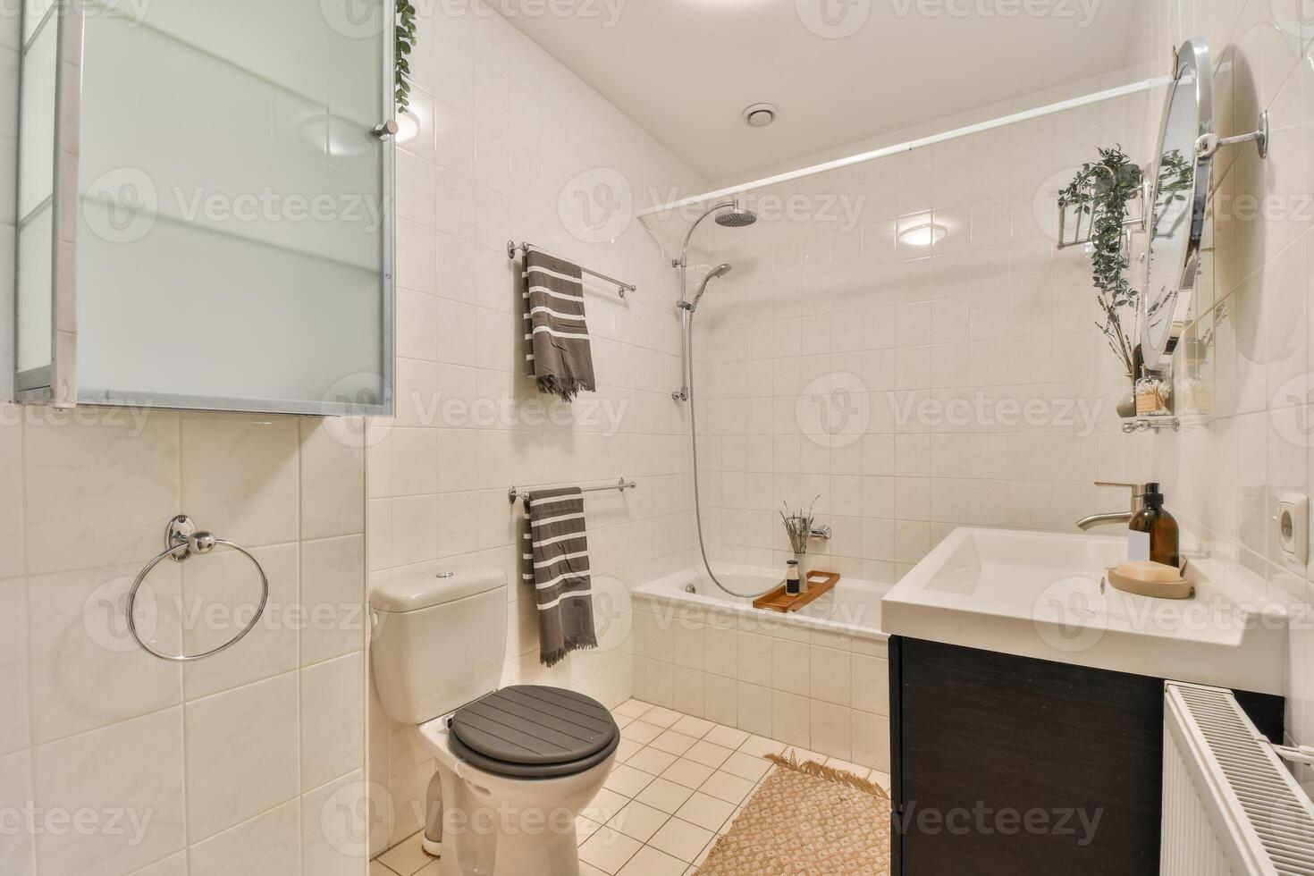 A bathroom with a toilet, sink, and shower photo