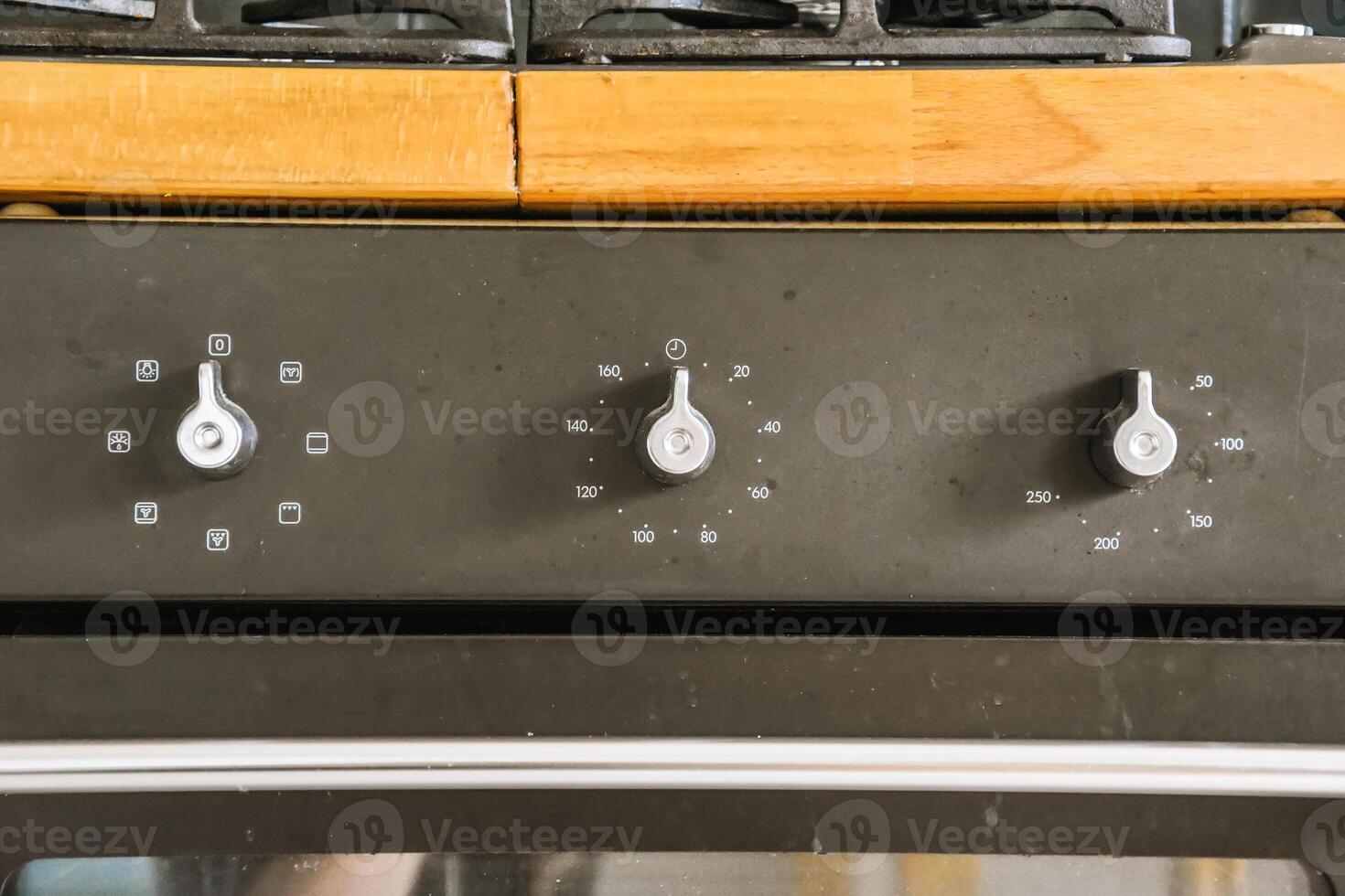 A close up of the oven controls on a stove photo