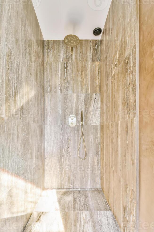 A bathroom with a shower and a walk in shower photo