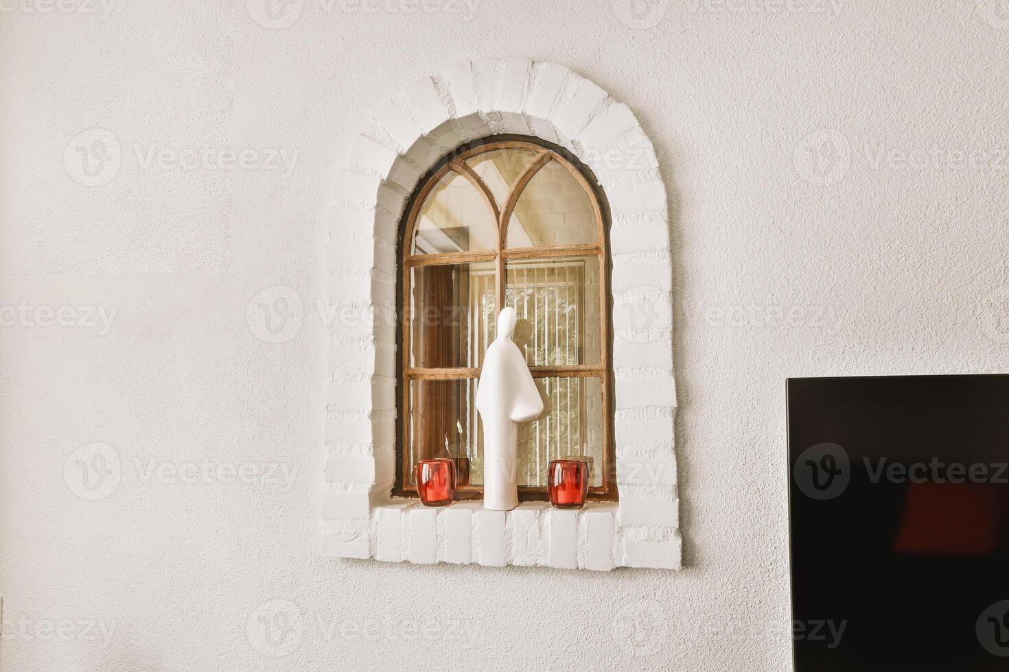 A window with a towel hanging from it photo