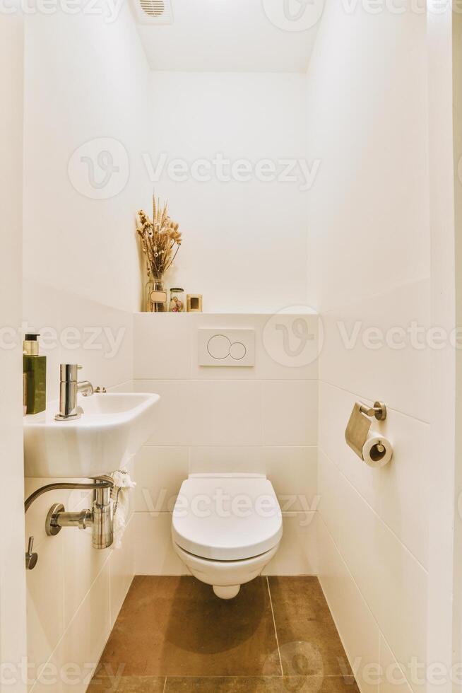 A bathroom with a toilet and a sink photo