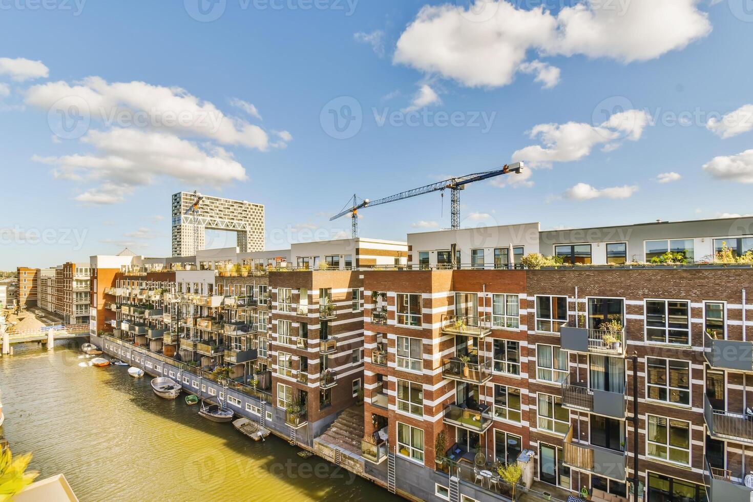 Amsterdam, netherlands - cityscape with canal and buildings photo