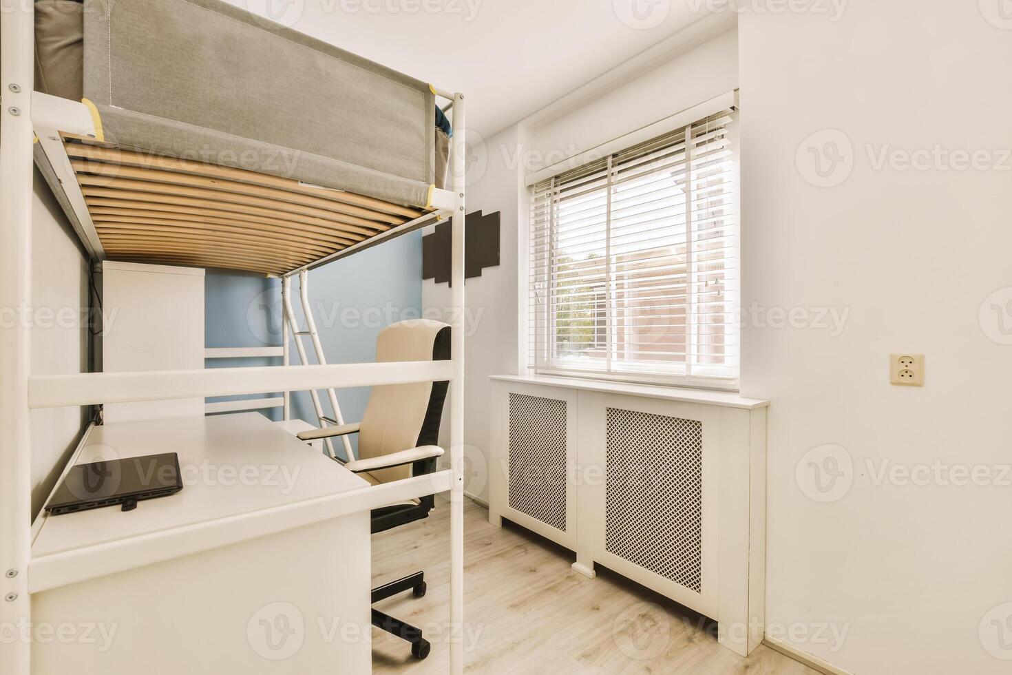 A bunk bed with a desk and chair in a small room photo