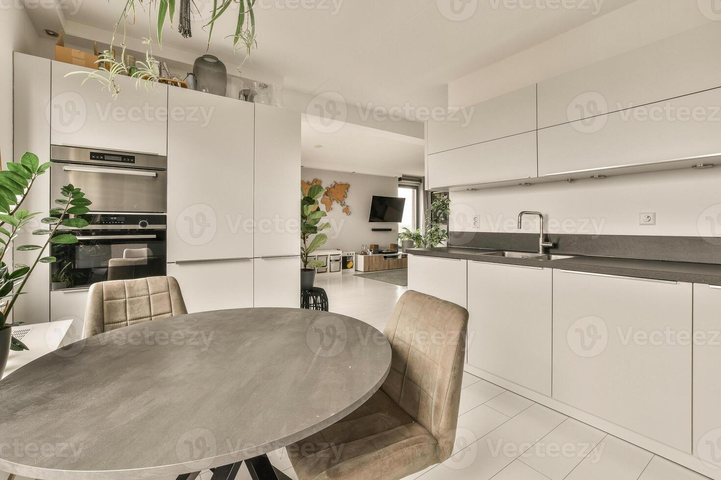 A kitchen with a table and chairs in it photo