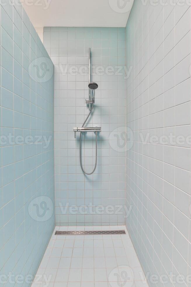A shower with a shower head and a shower head photo