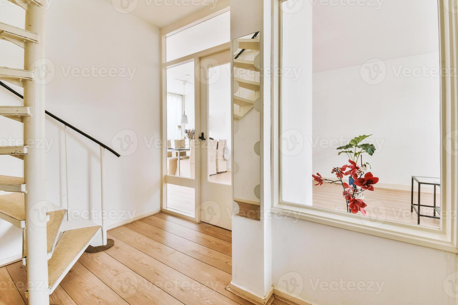 A white staircase in a hallway with a mirror photo