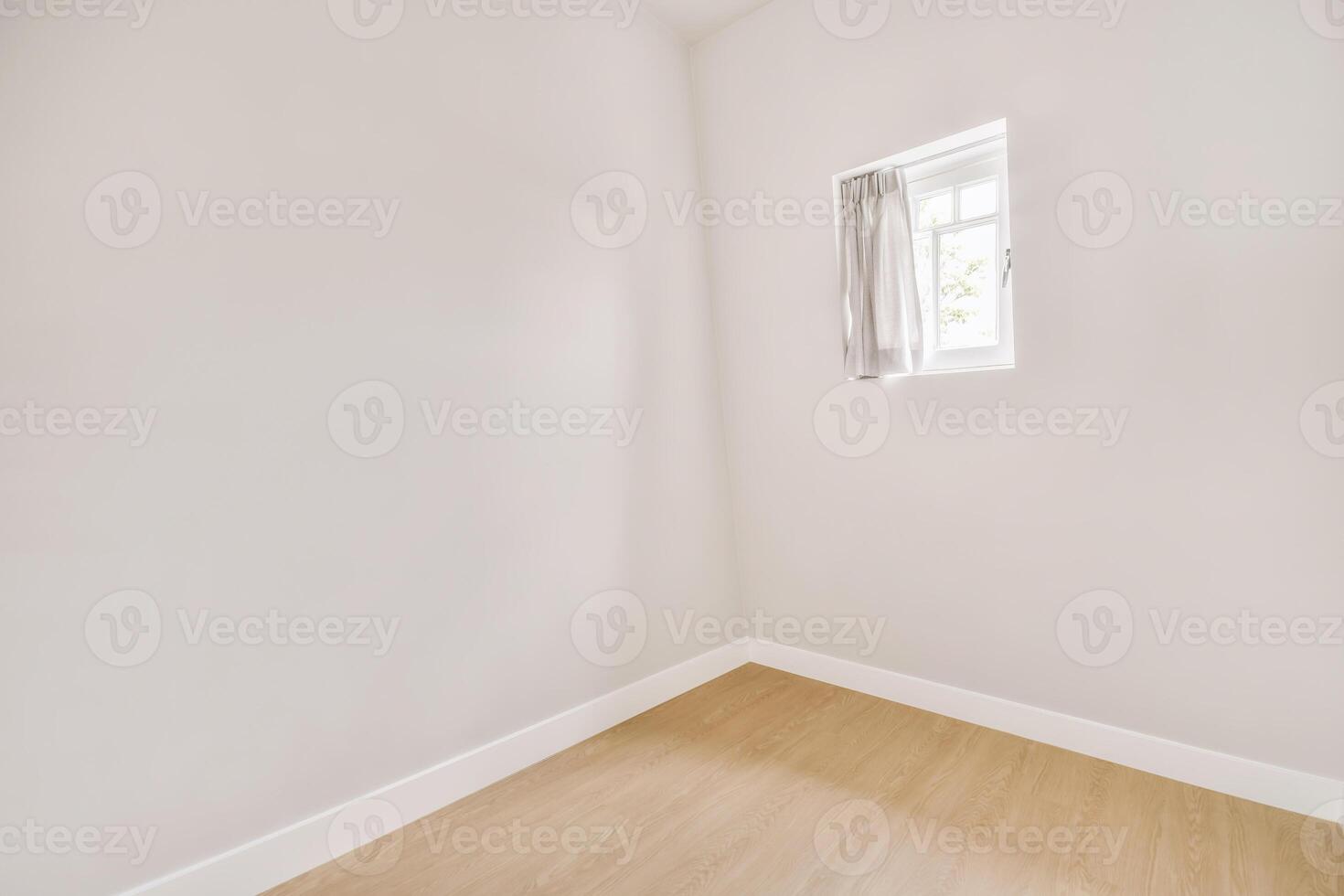 Empty room with white walls and wooden floor photo
