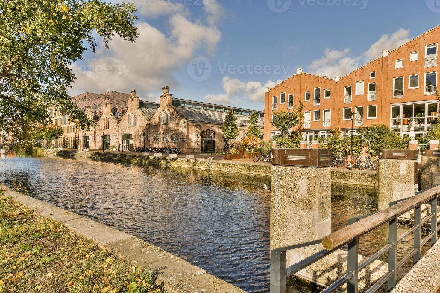 A canal with a bridge photo