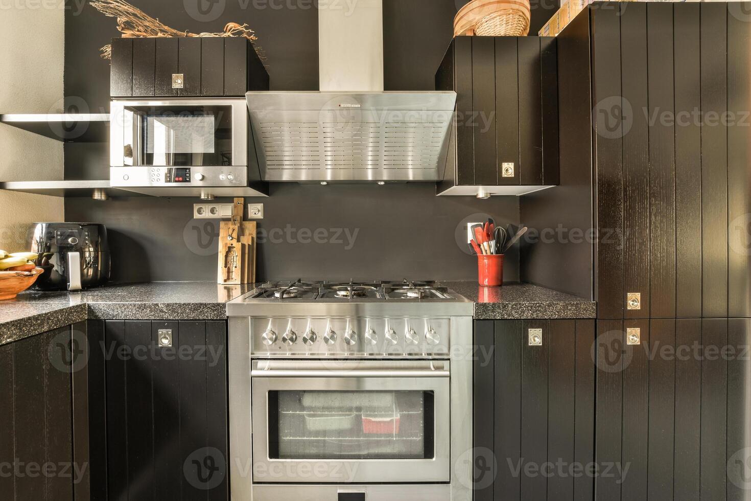 A kitchen with a stove and oven photo