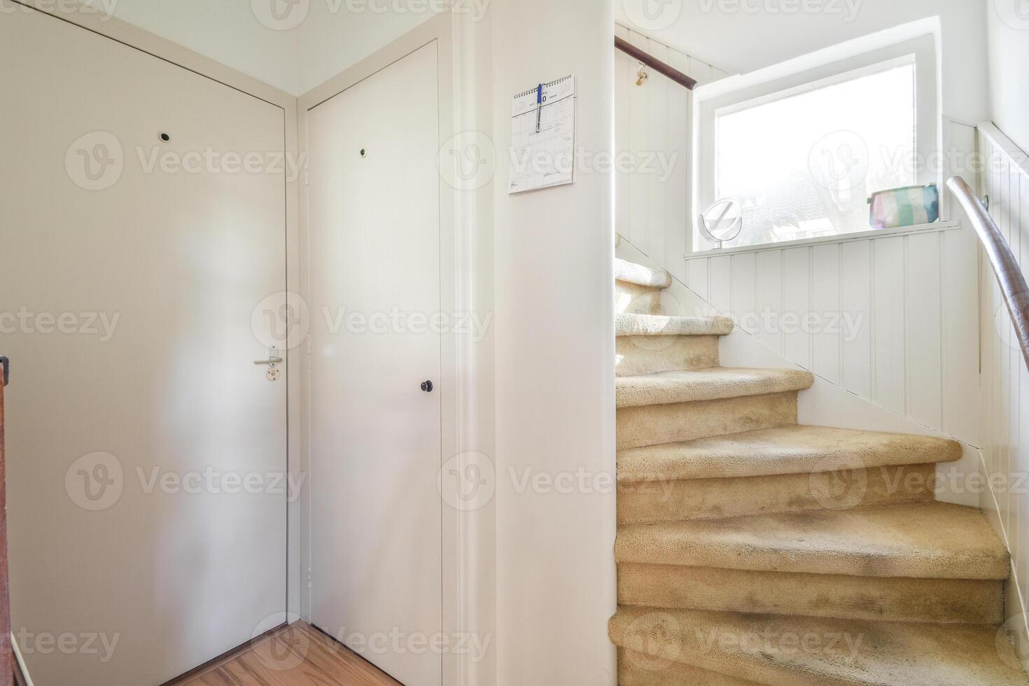 A stairway with a door and a white door photo
