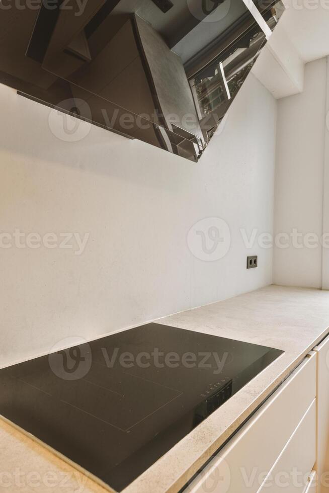 A kitchen with a stove and a sink photo