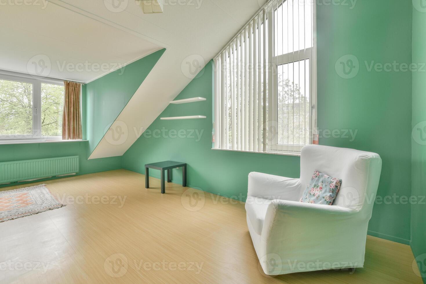 A room with a chair and a window photo