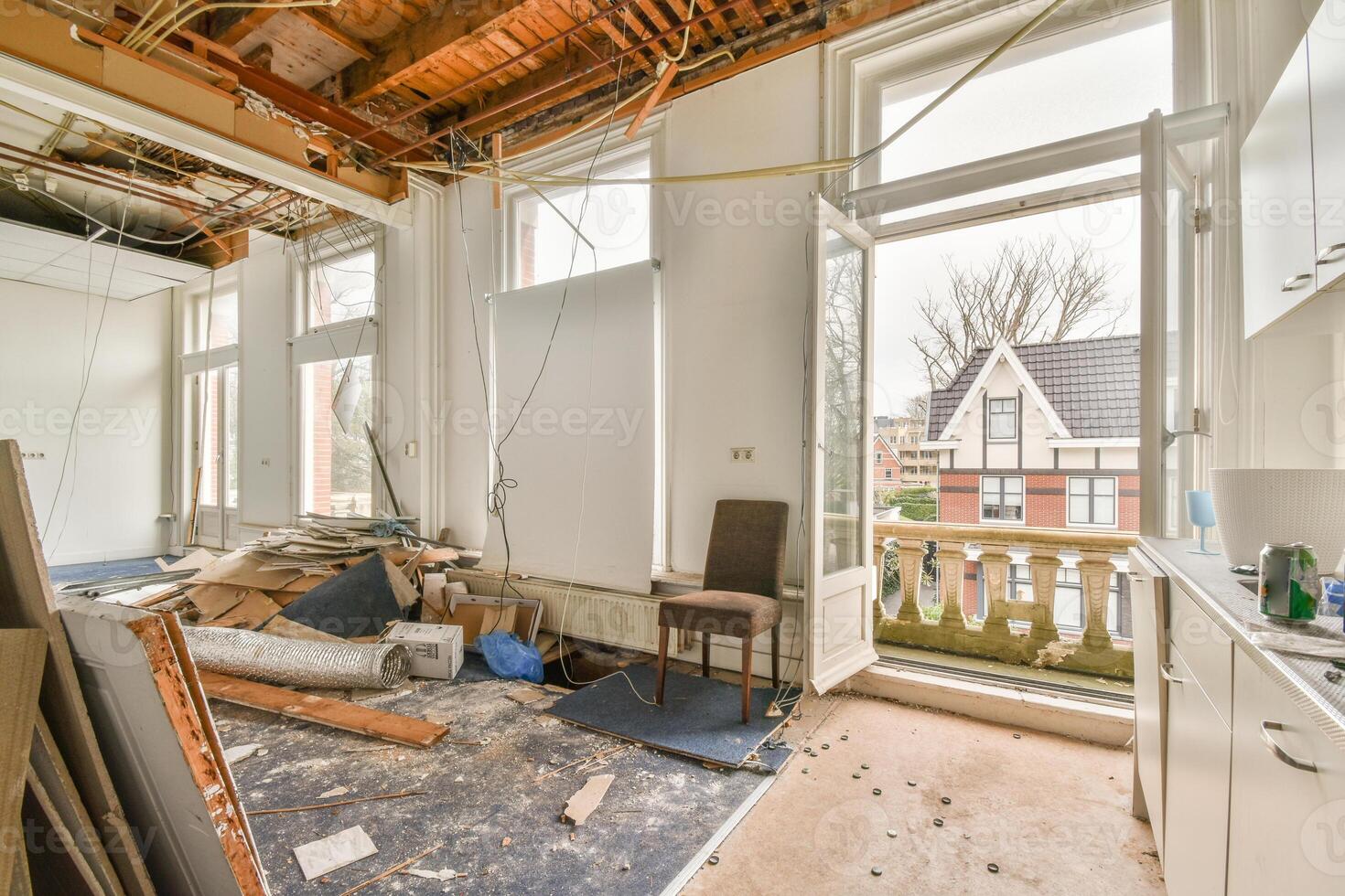 A room with a lot of construction materials and a window photo