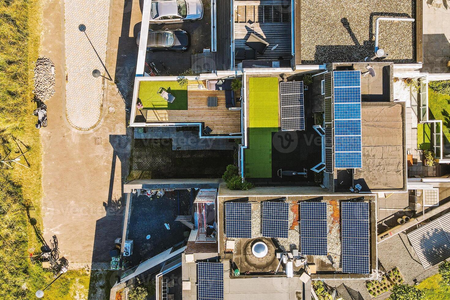 Aerial view of a house with solar panels on the roof photo